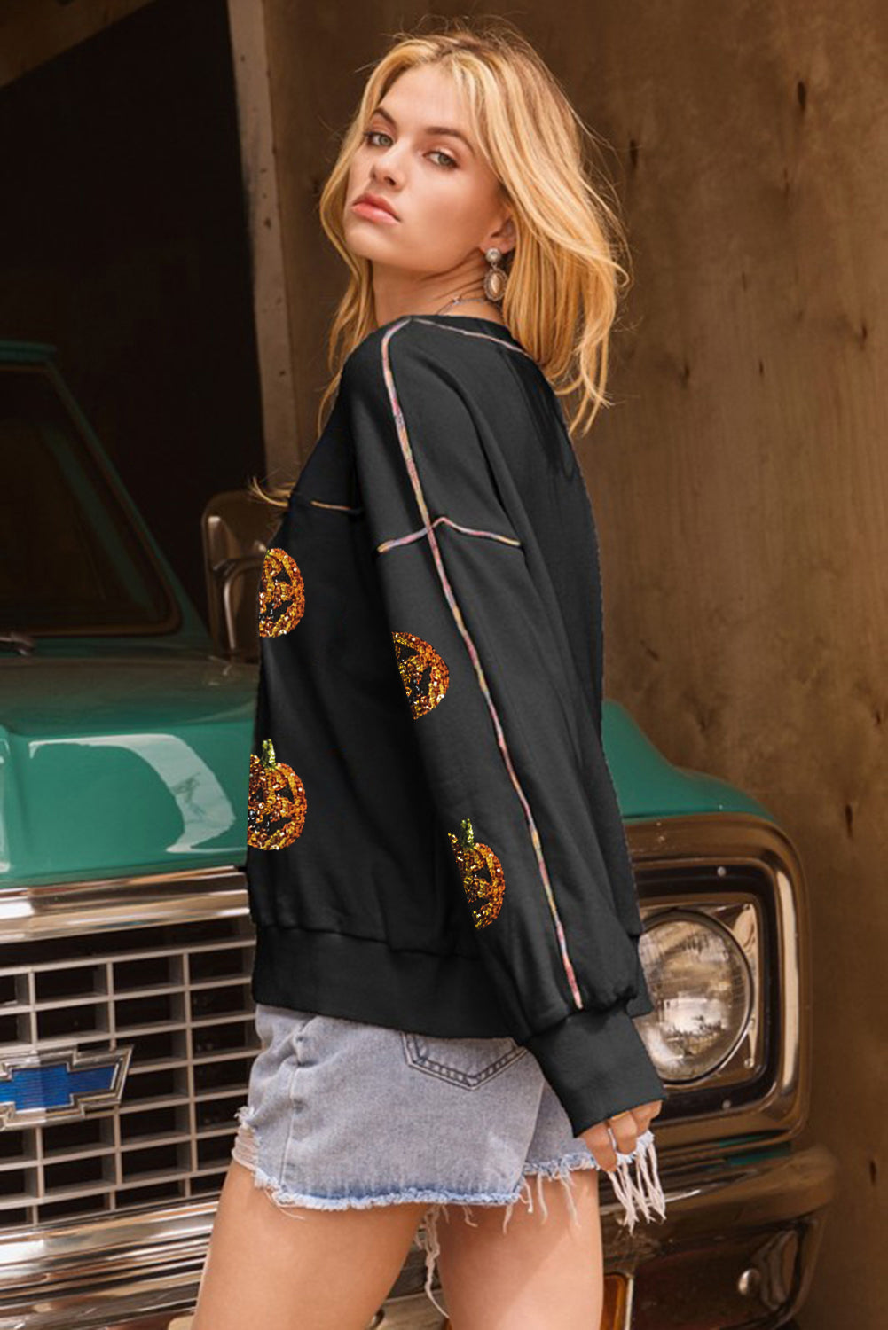 Sequin Pumpkin Face Graphic Exposed Seam Halloween Sweatshirt | Black