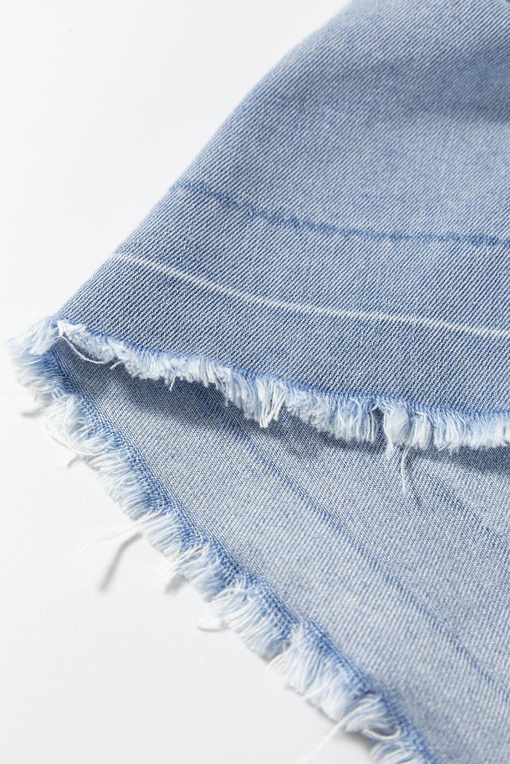 Light Wash Exposed Stitching Raw Hem V Neck Denim Top | Beau Blue