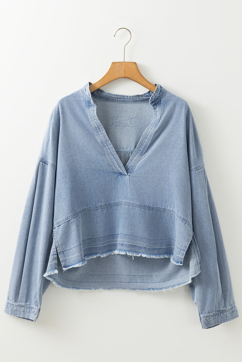 Light Wash Exposed Stitching Raw Hem V Neck Denim Top | Beau Blue