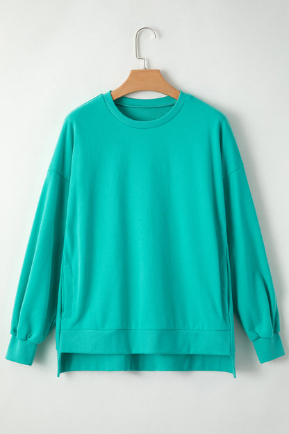 Solid O Neck High Low Hem Pullover Sweatshirt | Aruba Blue