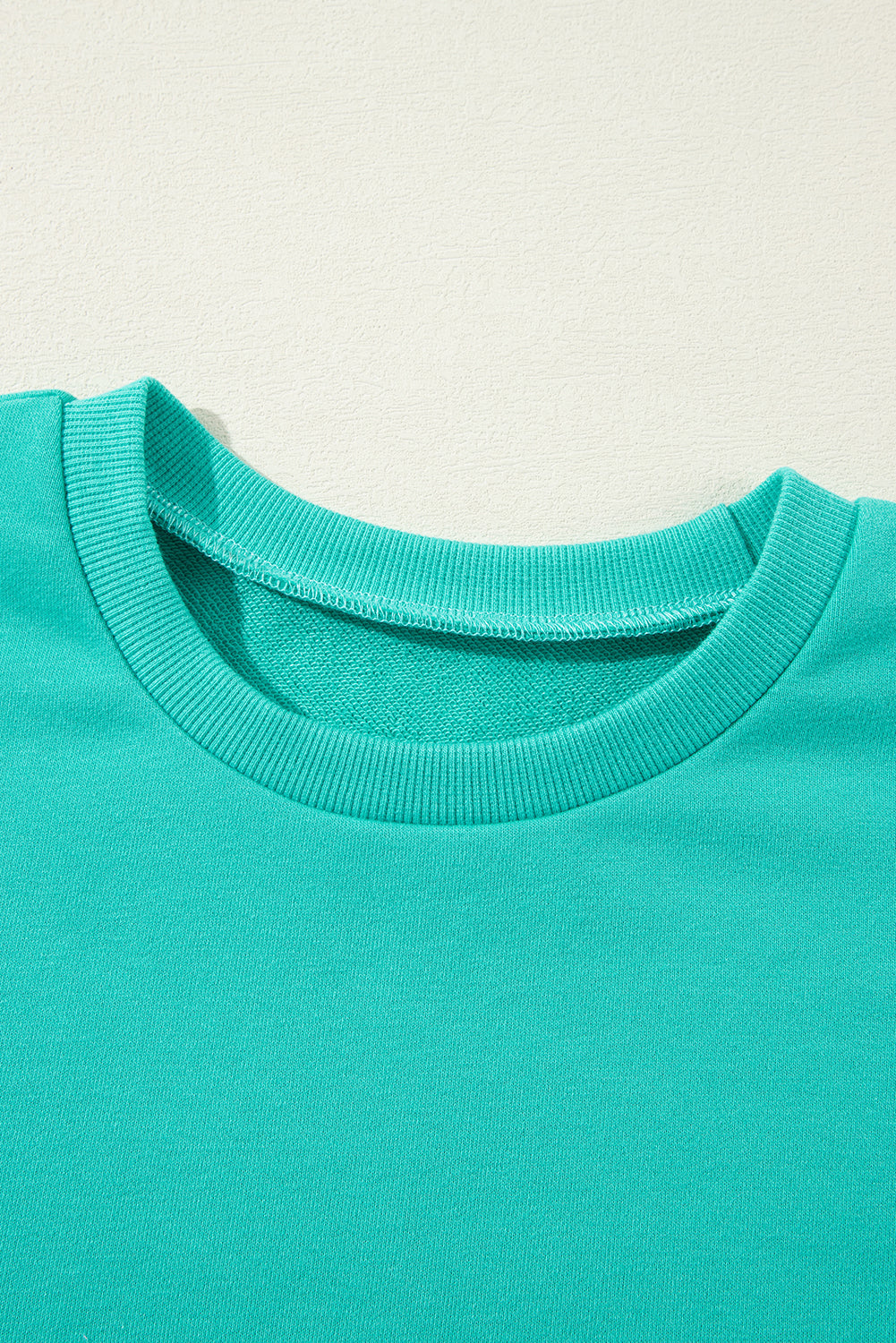 Solid O Neck High Low Hem Pullover Sweatshirt | Aruba Blue