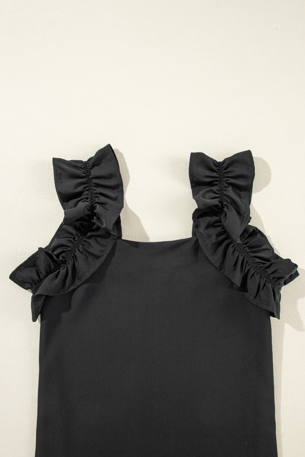 Solid Ruffle Trim Sleeveless Top | Black