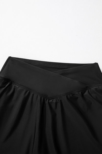 Solid Pocketed Crossover High Waist Swim Skort | Black