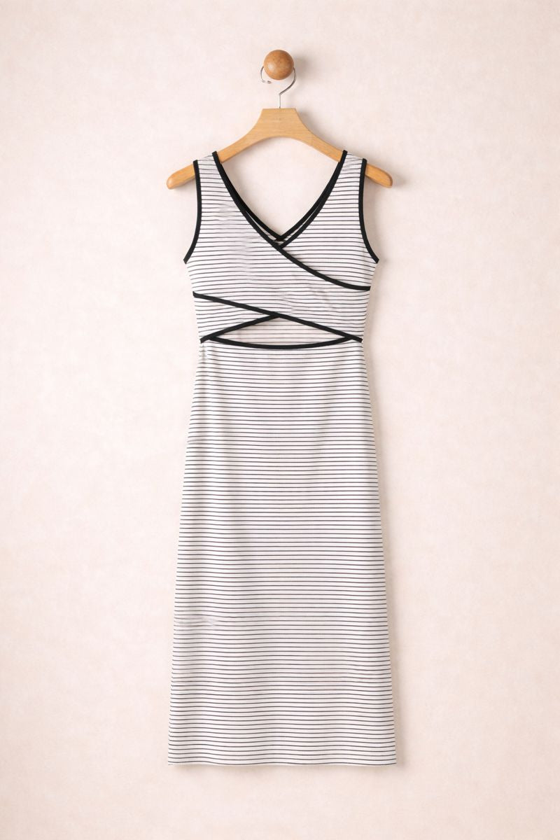 Striped dress on a hanger against a beige background