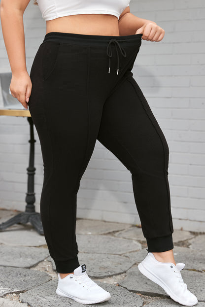 Plus Size Textured Exposed Seam Drawstring Jogger Pants | Black