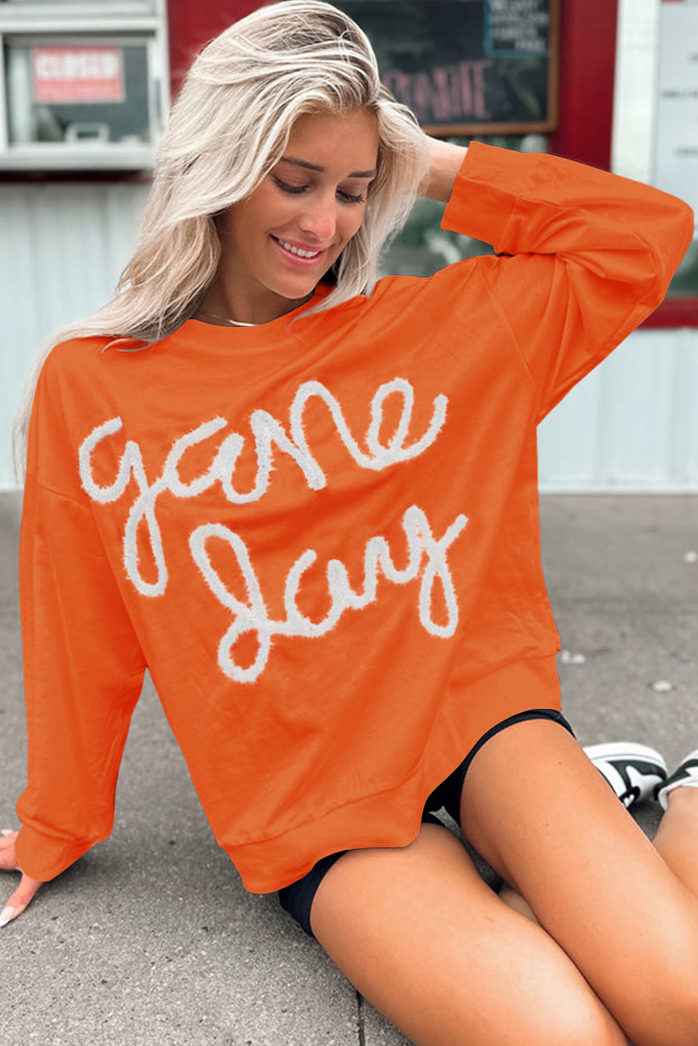 Tinsel Game Day Drop Shoulder Graphic Sweatshirt | Russet Orange