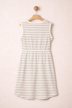 Striped dress on a hanger against a plain background